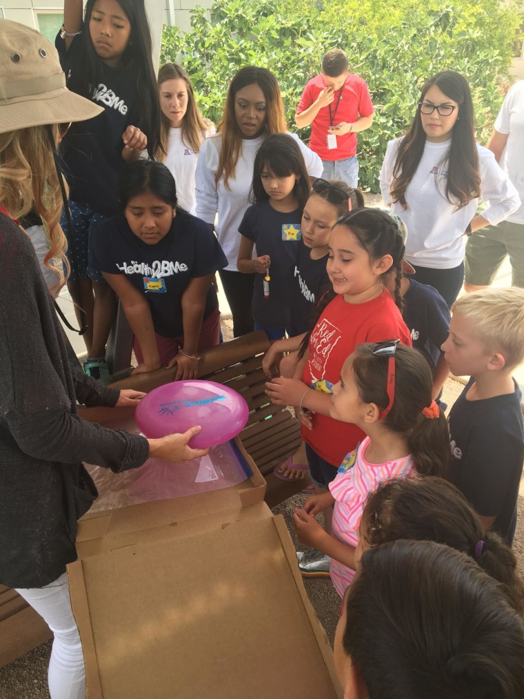 Children gathered for a Healthy 2B Me camp demonstration